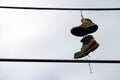 Shoes Hanging from a telephone wire Royalty Free Stock Photo