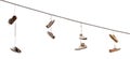 Shoes hanging by a thread Royalty Free Stock Photo