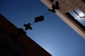 Shoes hanging from wire in Laneway Royalty Free Stock Photo