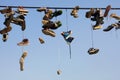 Shoes hanging on wire Royalty Free Stock Photo