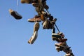 Shoes hanging on wire Royalty Free Stock Photo