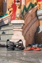 Shoes left at the entrance to the Buddhist temple. Concept of observing traditions, tolerance. Compliance with the rules. Royalty Free Stock Photo