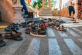 Shoes left at the entrance to the Buddhist temple. Concept of observing traditions, tolerance, gratitude and respect. Royalty Free Stock Photo