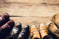 Shoes for men various styles on a wooden floor - lifestyles. Royalty Free Stock Photo