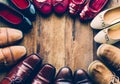 Shoes with men and women various styles on a wooden floor Royalty Free Stock Photo