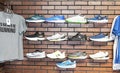 Shoes and shirts hanging on the wall of a running shoe store Royalty Free Stock Photo