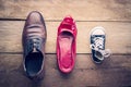 Shoes, three pairs of dad, mom, son - the family concept