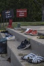 Shoes and toys at memorial by catholic church in tribute to 215 indigenous aboriginal children