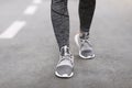 Shoes For Training. Female Legs In Sportswear And Sneakers Walking On Path Royalty Free Stock Photo