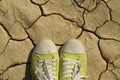 shoes on the yellow ground in hote summer Royalty Free Stock Photo