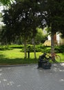 Shoeshine Grandpa Sculpture in Park