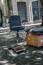 Shoeshiner Equipments in the Street: Chair, Wooden Footrest, Brushes and Rag