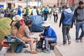 Shoeshiner working in Cusco street, Peru