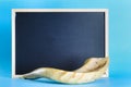 Shofar horn and chalkboard for text.