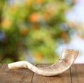 Shofar (horn) on wooden table. rosh hashanah (jewish holiday) concept . traditional holiday symbol.