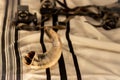 A shofar is placed on a tallit,