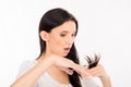 Shoked young woman cutting her split ends Royalty Free Stock Photo