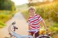 Shool kid boy having fun with riding of bicycle Royalty Free Stock Photo