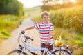 Shool kid boy having fun with riding of bicycle Royalty Free Stock Photo