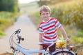 Shool kid boy having fun with riding of bicycle Royalty Free Stock Photo