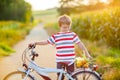 Shool kid boy having fun with riding of bicycle Royalty Free Stock Photo