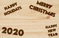 Merry Christmas and Happy New Year 2020 Background. Burned in wood
