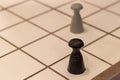 Shoot of wooden big size checkers and figure under clean light Royalty Free Stock Photo