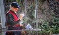 Shooter from a gun practicing shooting on plates in nature Royalty Free Stock Photo