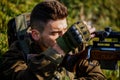 Shooter sighting in the target. The man is on the hunt. Hunt hunting rifle. Hunter man. Hunting period. Male with a gun Royalty Free Stock Photo