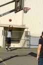 Shooting basketball at hoop