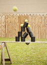 Shooting cans with balls Royalty Free Stock Photo