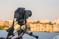 The shooting of the cityscape from the roof. A digital SLR camera is mounted on a tripod Royalty Free Stock Photo