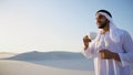 Portrait of handsome young Arabian Sheikh who drinks from cup of Royalty Free Stock Photo