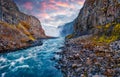 Shooting from a dron. View from down of canyon of most powerful waterfall in Europe - Dettifoss. Spectacular summer sunset in Joku Royalty Free Stock Photo