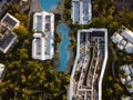 Shooting from a drone. Palm trees, swimming pools, roofs of tall buildings and small houses. Hotels, resort place. Paradise place