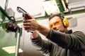 Shooting a gun at a shooting range