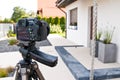 Shooting house exterior, photographer camera, tripod and ballhead Royalty Free Stock Photo