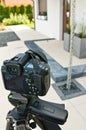 Shooting house exterior, photographer camera, tripod and ballhead Royalty Free Stock Photo