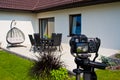 Shooting house exterior, photographer camera, tripod and ballhead Royalty Free Stock Photo