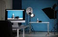 Shooting of men`s shoes and belt for product promotion in photo studio, focus on PC