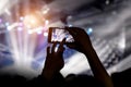 Shooting on mobile phone. Concert on stage Royalty Free Stock Photo