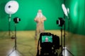 Shooting the movie on a green screen. The chroma key. Studio videography. Actor in theatrical costume