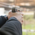 Shooting with a pistol. Man aiming pistol in shooting range. Royalty Free Stock Photo