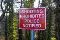 A Shooting Prohibited sign on a path used by anglers