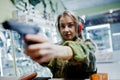 Military girl in camouflage uniform  on shooting range Royalty Free Stock Photo