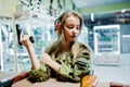 Military girl in camouflage uniform  on shooting range Royalty Free Stock Photo