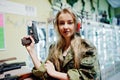 Military girl in camouflage uniform  on shooting range Royalty Free Stock Photo