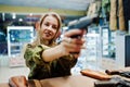 Military girl in camouflage uniform  on shooting range Royalty Free Stock Photo