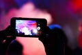 Shooting on smartphone festival concert Royalty Free Stock Photo