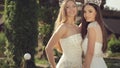 Shooting of two gorgeous girls in wedding dresses